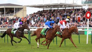 Earthlight (centre) stayed unbeaten with victory in the Middle Park (Nigel French/PA)